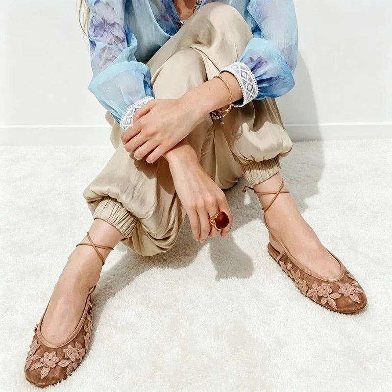 Women’s mesh ballet flats with embroidered floral design and breathable hollow detailing